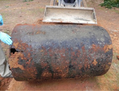 Corroded underground oil tank after removal.