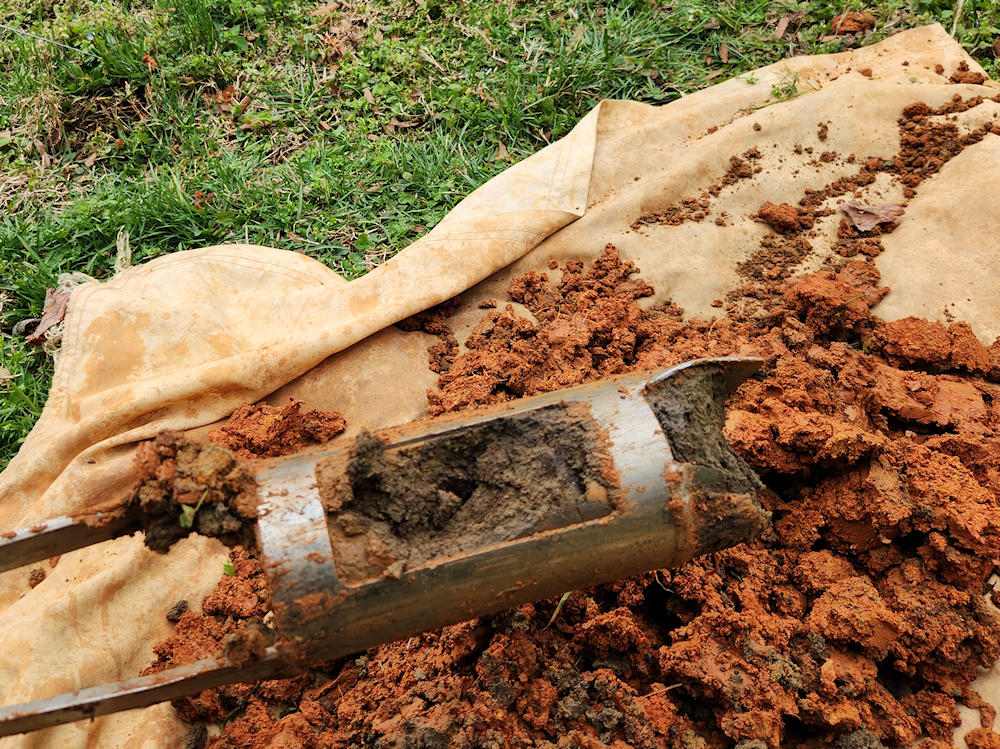 Discolored, petroleum contaminated soil from a soil boring beneath an underground oil tank.